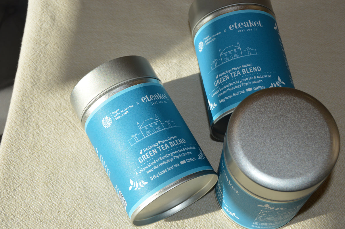 eteaket bespoke blend created in collaboration with Royal Botanic Gardens Edinburgh. Image features 3 tins with custom illustration of the Herbology Physic Garden