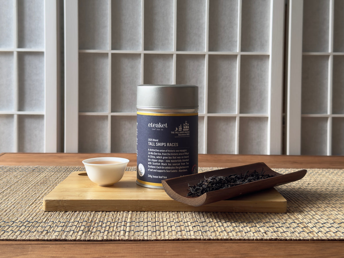 A bespoke tea collaboration for Tall Ships Aberdeen. A dark navy tin featuring custom colourways and logo rest alongside bespoke blend featuring Scottish Grown Tea.